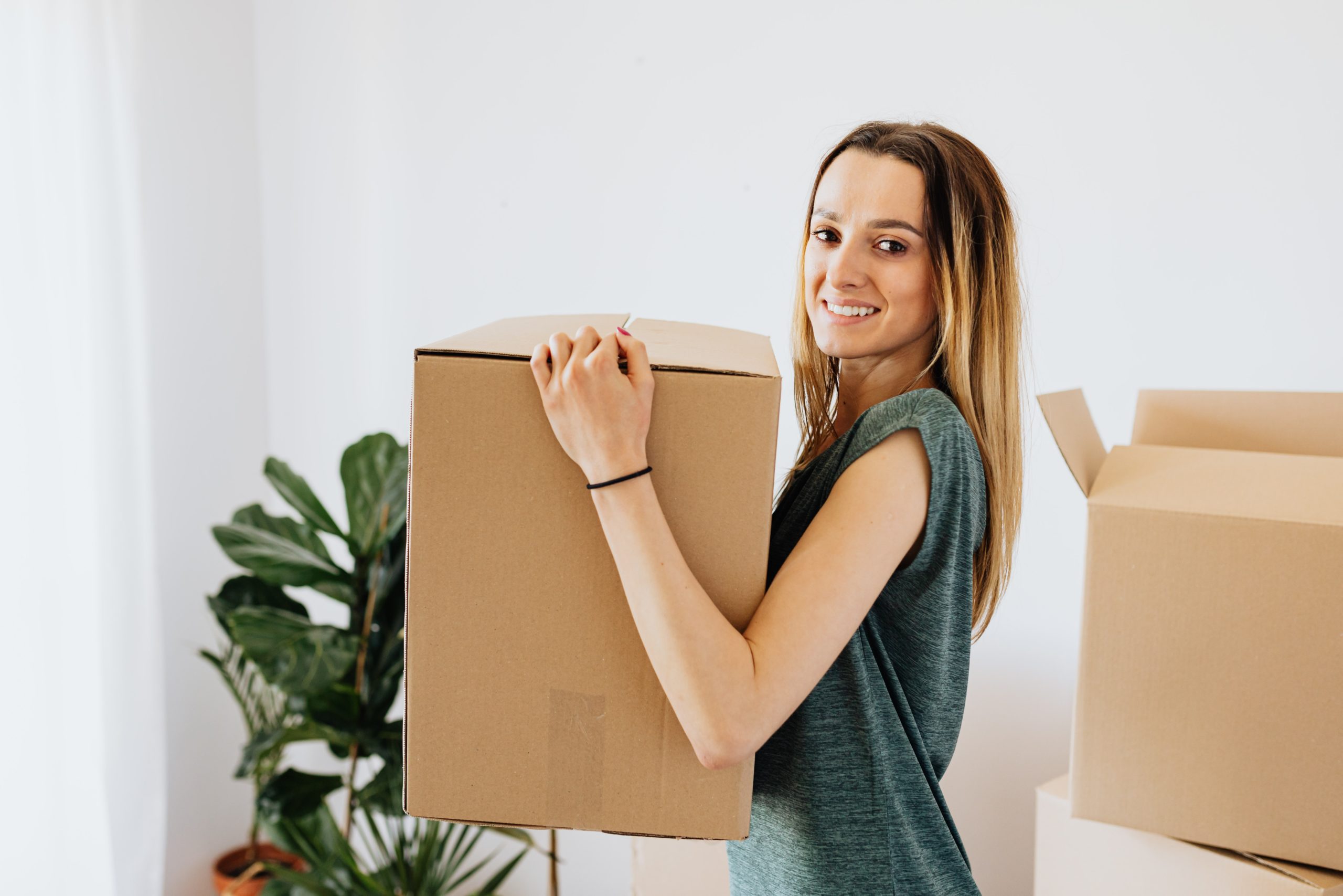Woman holding moving box