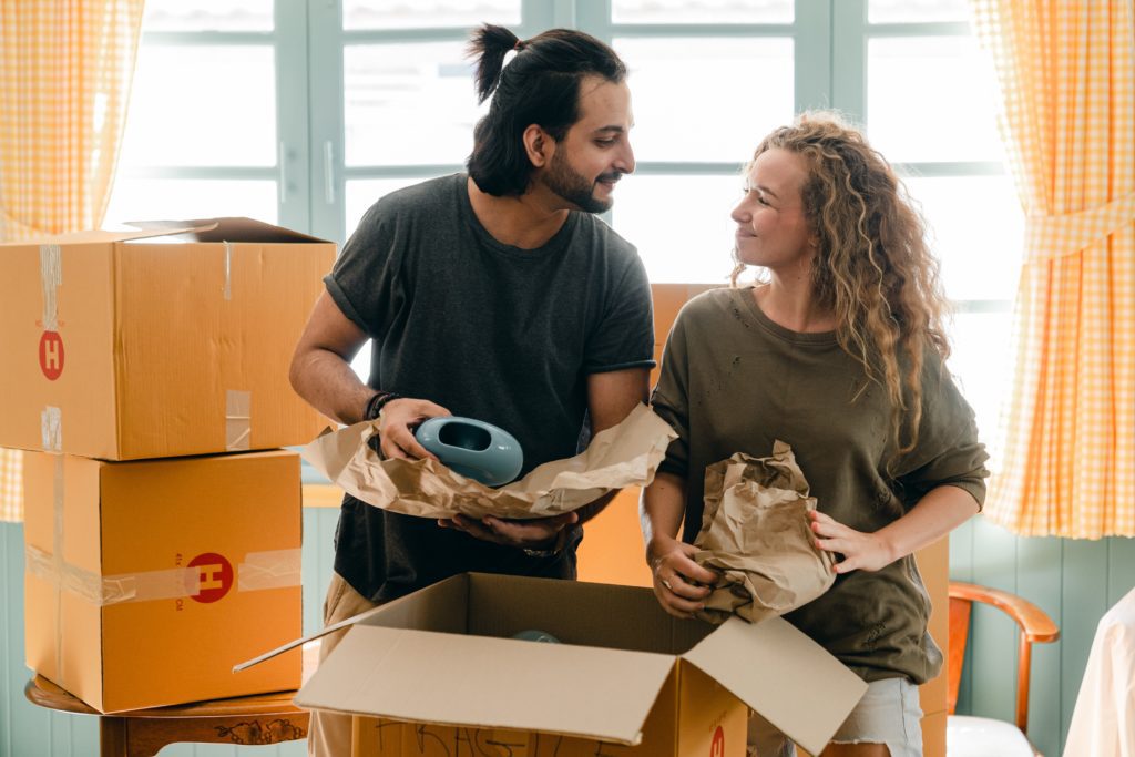 Couple packing first night box for house move